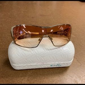 Oakley Dart Sunglasses with Gold Frame and case.